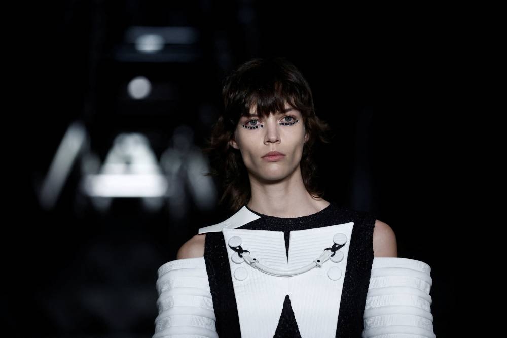 A model presents a creation by designer Nicolas Ghesquiere as part of his Fall-Winter 2023/2024 Women's ready-to-wear collection show for fashion house Louis Vuitton during Paris Fashion Week in Paris, France, March 6, 2023. REUTERS/Benoit Tessier