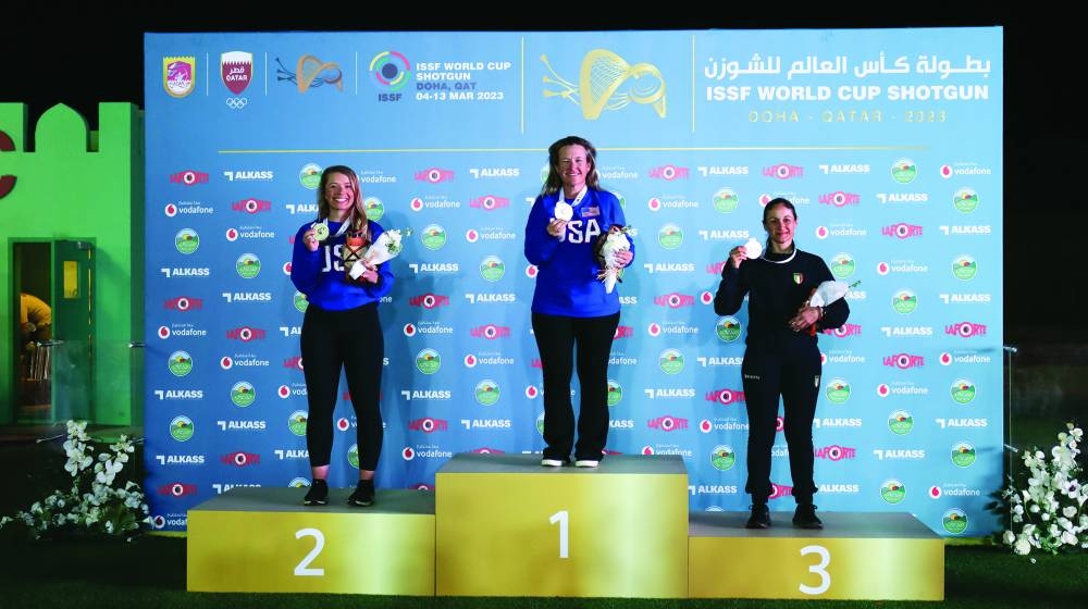 Women’s skeet winner Kimberly Rhode of USA (centre) poses with compatriot and silver-medallist Samantha Simonton (left) and bronze-medallist Simona Scocchetti of Italy.
