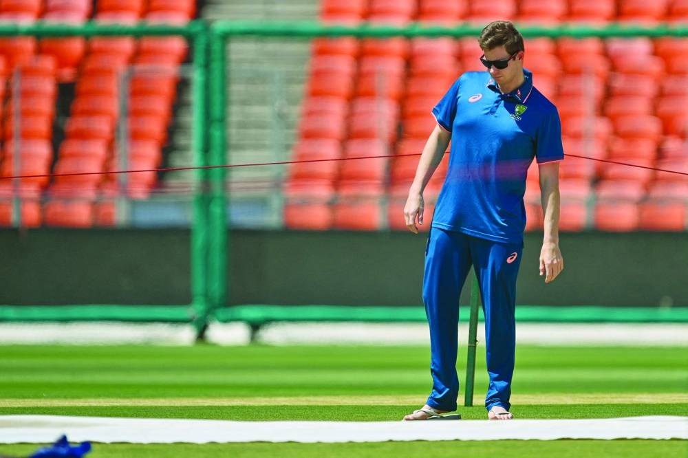 Australia's captain Steven Smith inspects the pitch in Ahmedabad. (AFP)