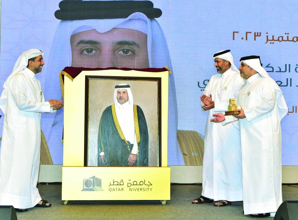 HE the Minister of Municipality Dr Abdullah bin Abdulaziz bin Turki al-Subaei (right) being honoured at the event by HE the Minister of Environment and Climate Change Dr Sheikh Faleh bin Nasser al-Thani and QU president Dr Hassan al-Derham.