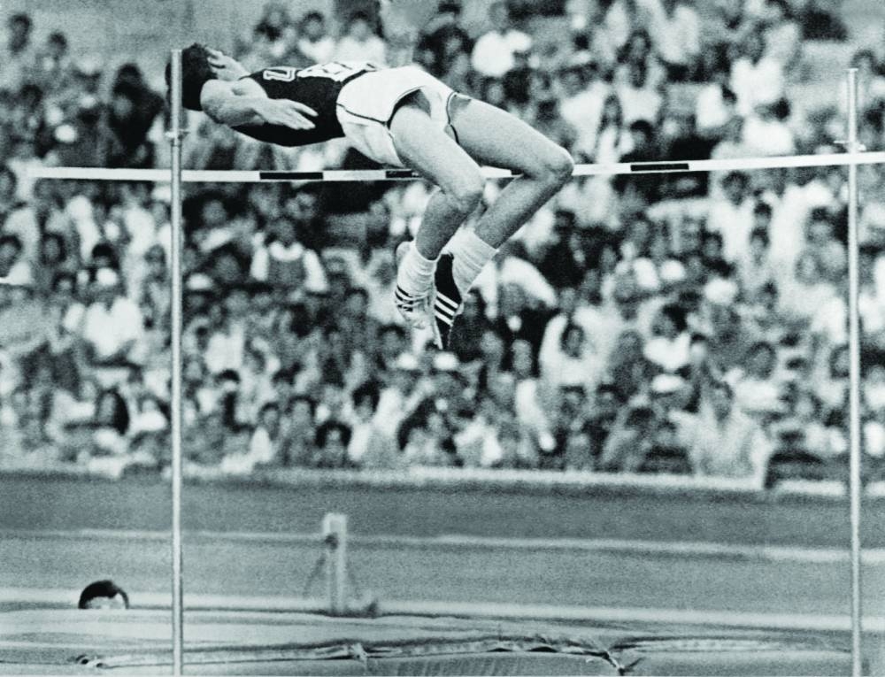 In this file photograph taken on October 20, 1968, US athlete Dick Fosbury competes in the men’s high jump final and wins the gold medal with a brand new style of jumping at the Mexico Olympic Games in Mexico City.  (AFP)