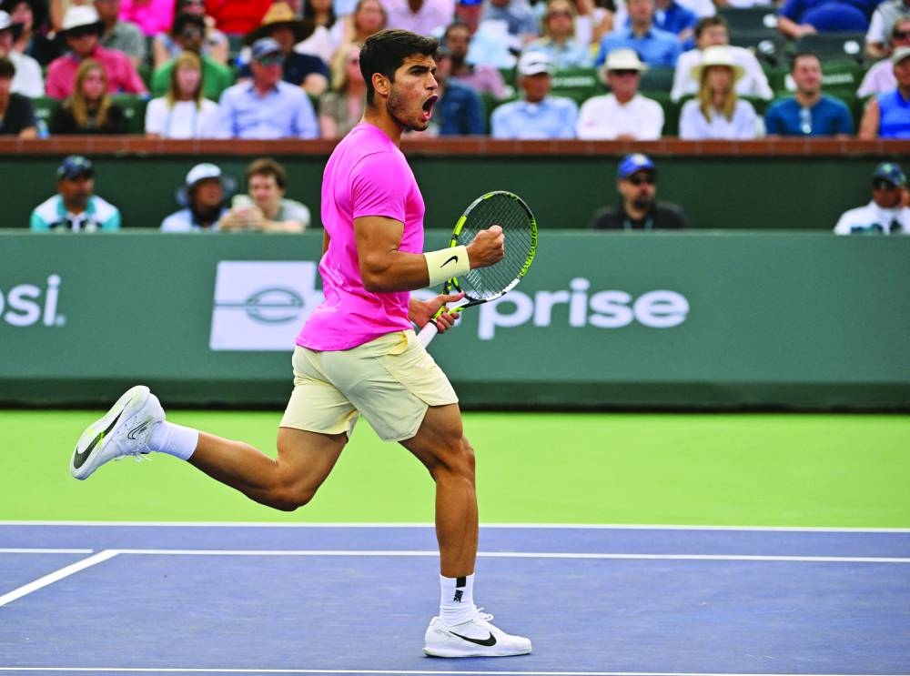 Carlos Alcaraz of Spain reacts after winning a point in his semi-final against Jannik Sinner of Italy in the BNP Paribas Open at the Indian Wells Tennis Garden.  (USA TODAY Sports/AFP)