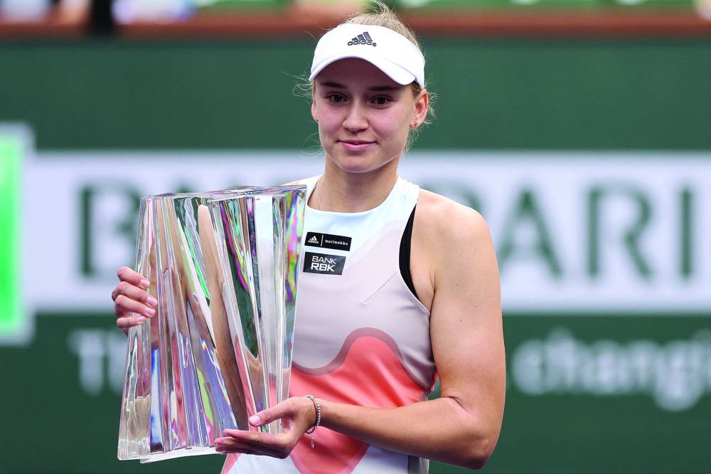 Elena Rybakina of Kazakhstan poses with the winner’s trophy after defeating Aryna Sabalenka of Belarus during the women’s final. (AFP)