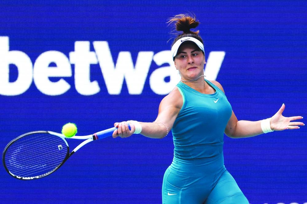 Bianca Andreescu of Canada hits a forehand against Emma Raducanu of Great Britain (not pictured) on day three of the Miami Open at Hard Rock Stadium. (USA TODAY Sports) 
