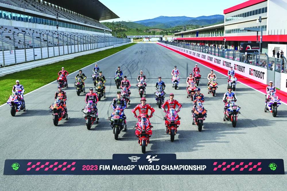 MotoGP riders pose for a group photograph ahead of the start of the new season this weekend. The first Grand Prix of 2023 takes place in Lisbon, Portugal, on Sunday. (@motogp)