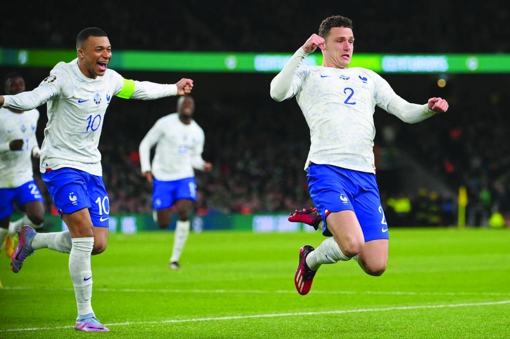 France’s Benjamin Pavard (right) celebrates after scoring against Ireland during the UEFA Euro 2024 qualification match. (AFP)