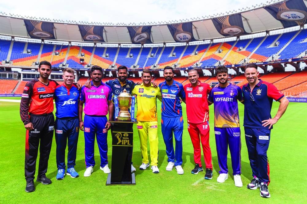Captains of the Indian Premier League teams pose with the trophy before the tournament opener in Ahmedabad on Thursday.