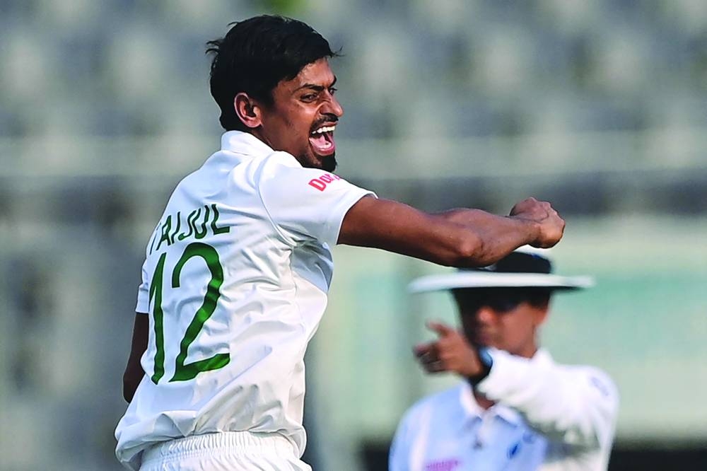 Bangladesh’s Taijul Islam celebrates after taking the wicket of Ireland’s Mark Adair (not pictured) during the first day of the Test against Ireland at the Sher-e-Bangla National Cricket Stadium in Dhaka yesterday. (AFP)