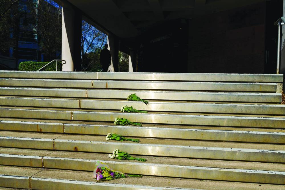 Bouquets of flowers lay at the entrance of the Old National Bank for the victims of the mass shooting in Louisville, Kentucky.