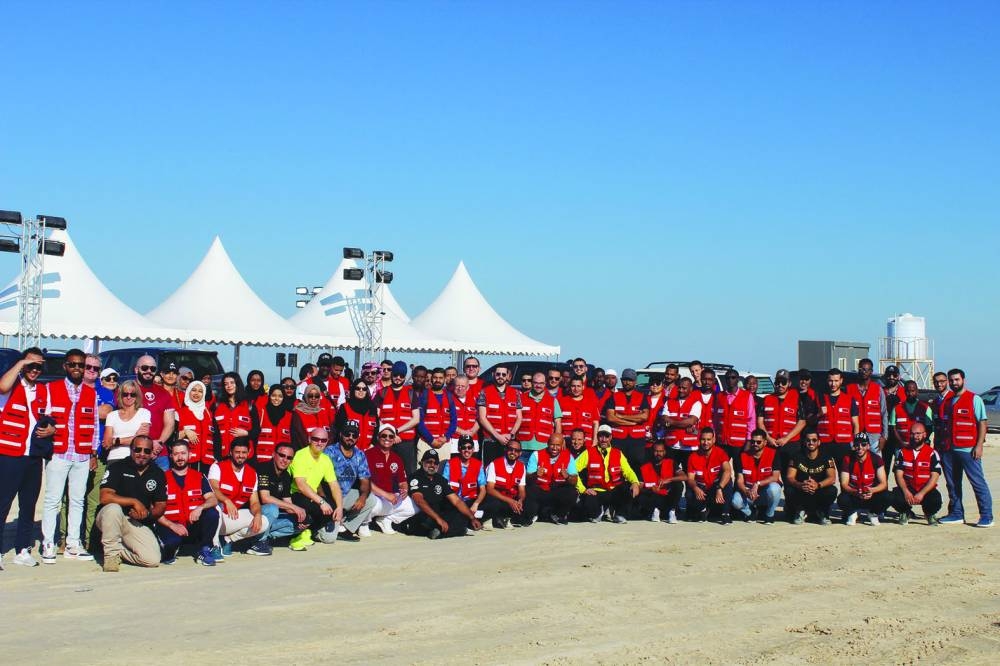 QRCS volunteers take part in the beach cleanup drive.