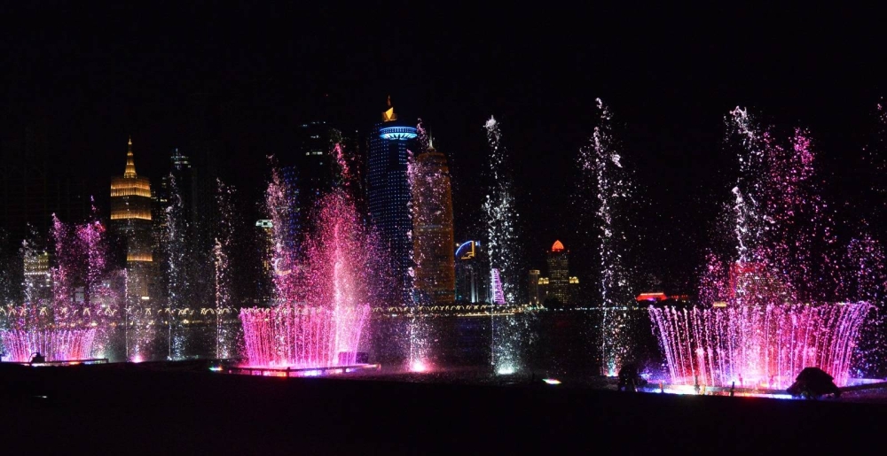 The colourful lights and music fountains on Doha Corniche