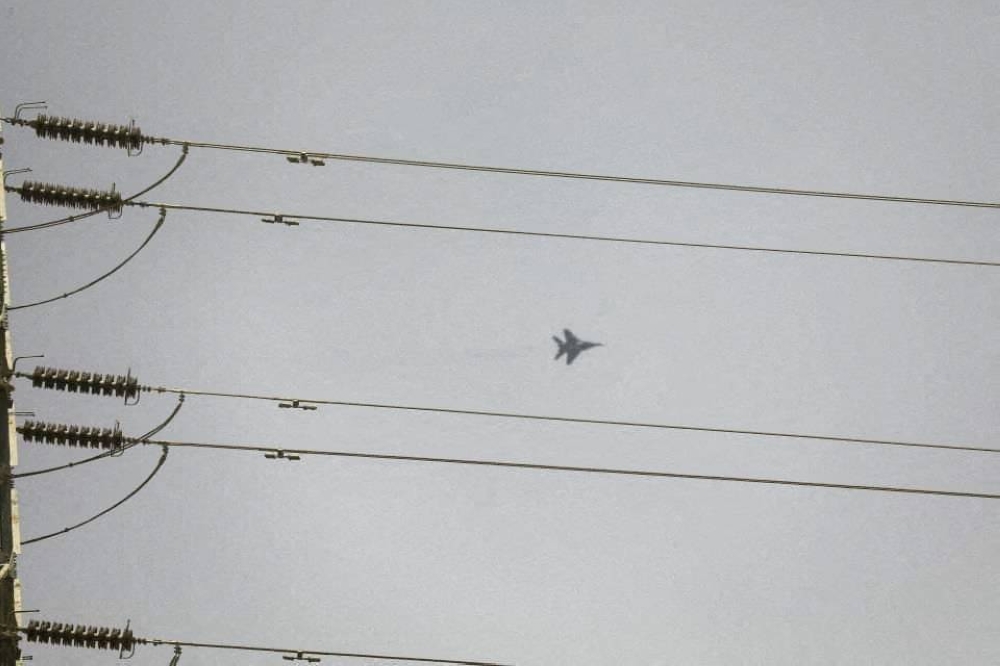 A fighter aircraft flies over Khartoum during clashes between the paramilitary Rapid Support Forces and the army in Khartoum, Sudan. REUTERS/Stringer
