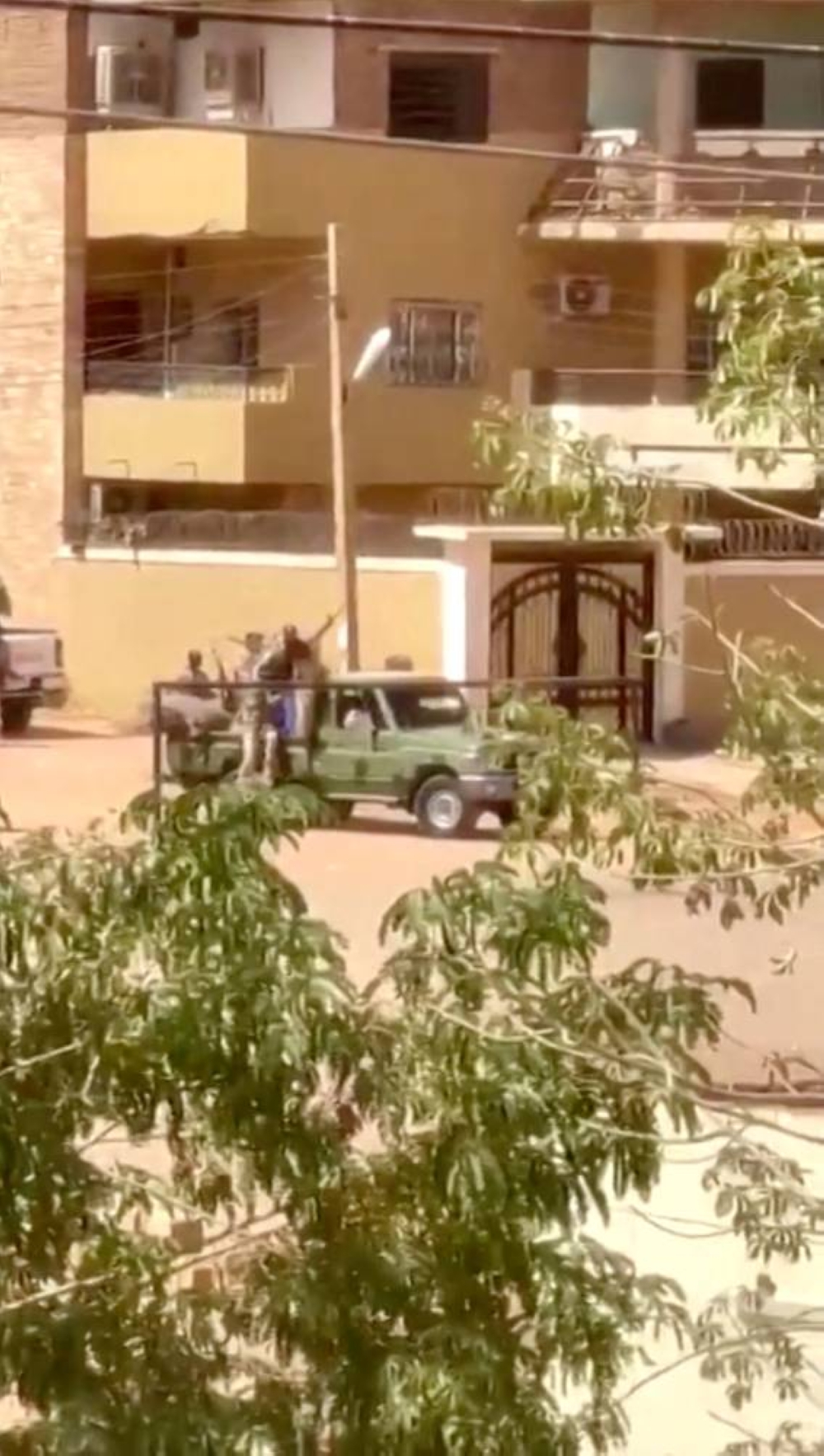 Military vehicles patrol the streets of Khartoum, Sudan in this picture screen grab obtained from a social media video. Bakri Jad/via REUTERS