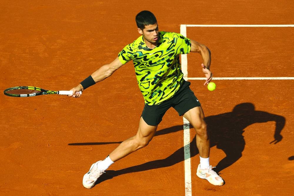 Spain's Carlos Alcaraz returns the ball to Portugal's Nuno Borges during the ATP Barcelona Open yesterday. (AFP)