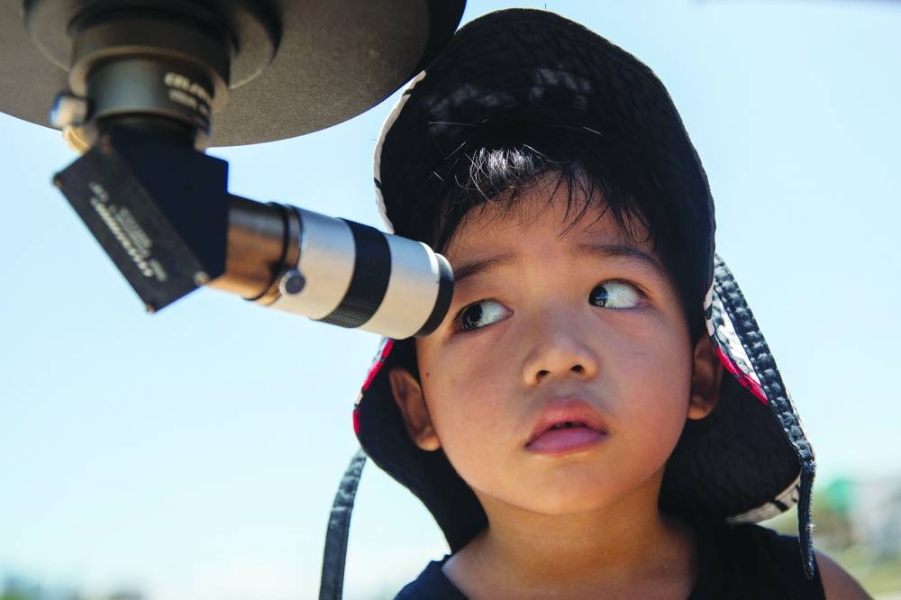 People gather to watch a total solar eclipse at a viewing site 35km from Exmouth, Western Australia.