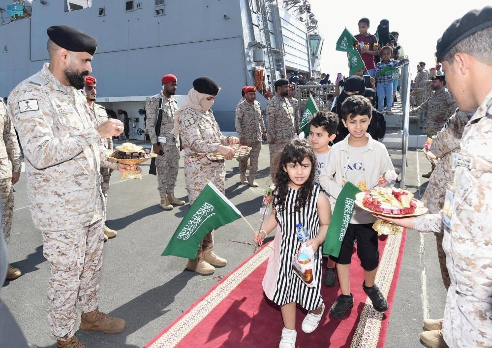 Citizens of Saudi Arabia and people from other nationalities are welcomed by Saudi Royal Navy officials as they arrive at Jeddah Sea Port after being evacuated through Saudi Navy Ship from Sudan to escape the conflicts, Jeddah, Saudi Arabia. Saudi Press Agency/Handout via REUTERS