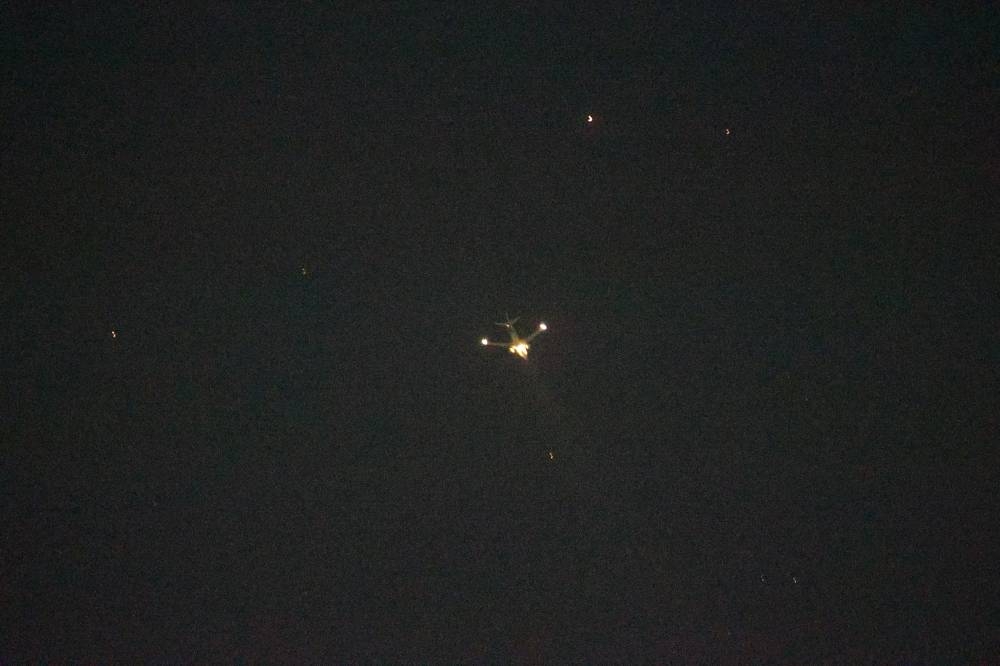 Fire is seen on a FlyDubai airplane after it takes off from Kathmandu airport in Nepal April 24, 2023 in this picture obtained from social media. @SubasTheOne/via REUTERS  