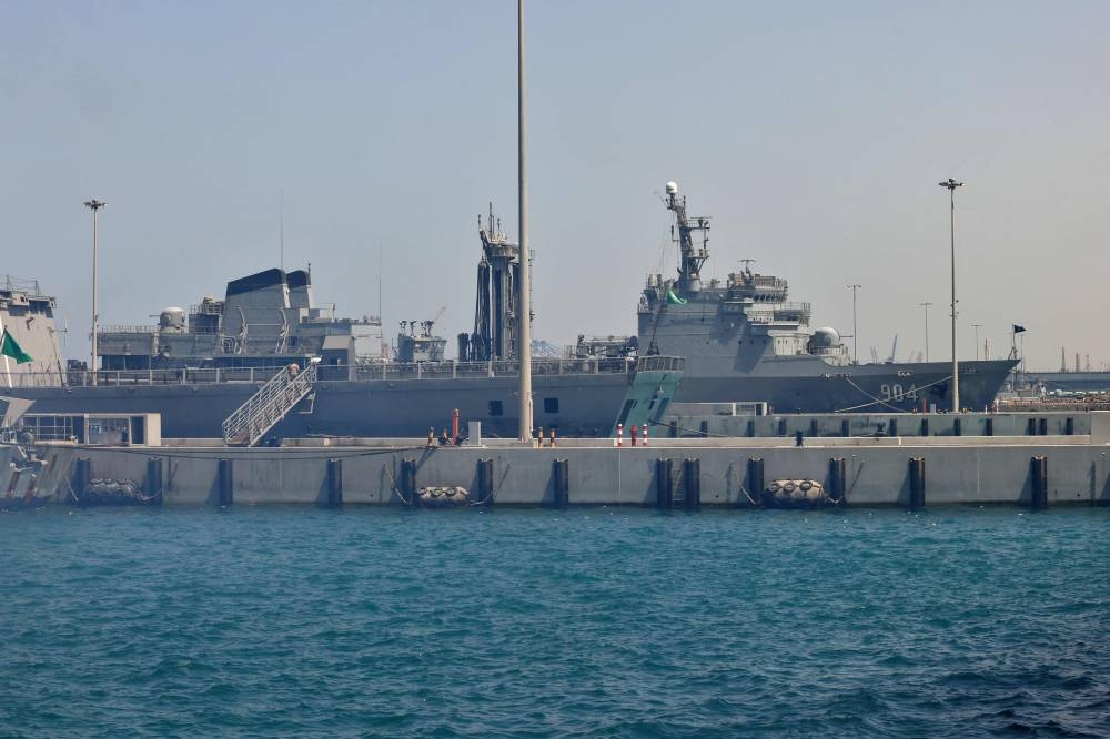 A Saudi navy ship is pictured at King Faisal navy base in Jeddah before the departure of a team to Port Sudan to help with the evacuation efforts of people fleeing Sudan. AFP