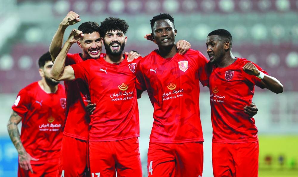 Al Duhail’s Michael Olunga (second right) celebrates with teammates after scoring against Umm Salal during the QNB Star League match at the Abdullah Bin Khalifa Stadium on Saturday.
