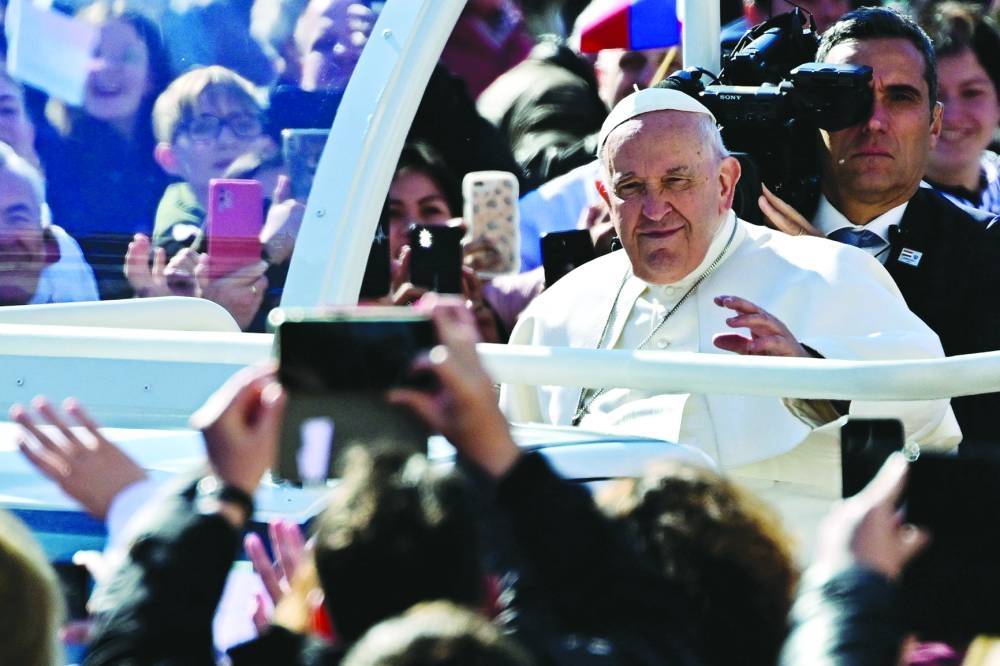 Pope Francis greets the crowd ahead of a mass at the Kossuth Lajos Square in Budapest yesterday. (Reuters)
