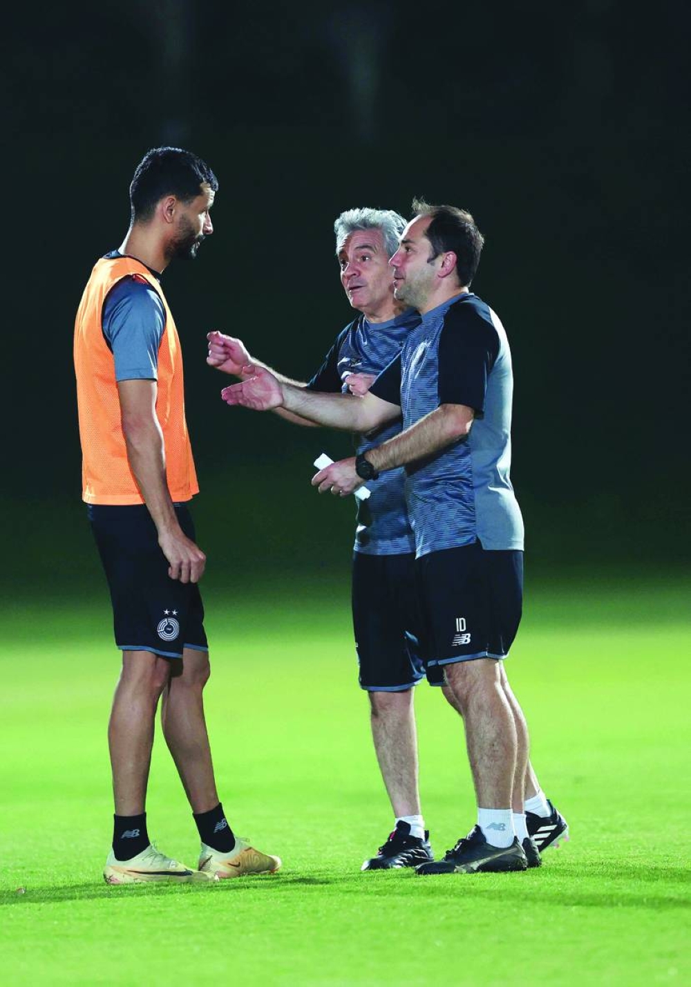 Al Sadd’s coach Juan Manuel Lillo Juanma (centre) speaks to defender Boualem Khoukhi at training on Wednesday.