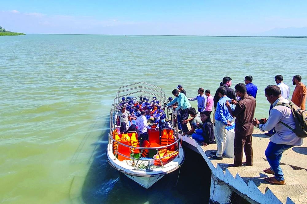 A Rohingya delegation board a boat from Teknaf jetty to visit Myanmar’s border district of Maungdow township as part of efforts to revive a long-stalled plan to return the people to their homeland. (AFP)