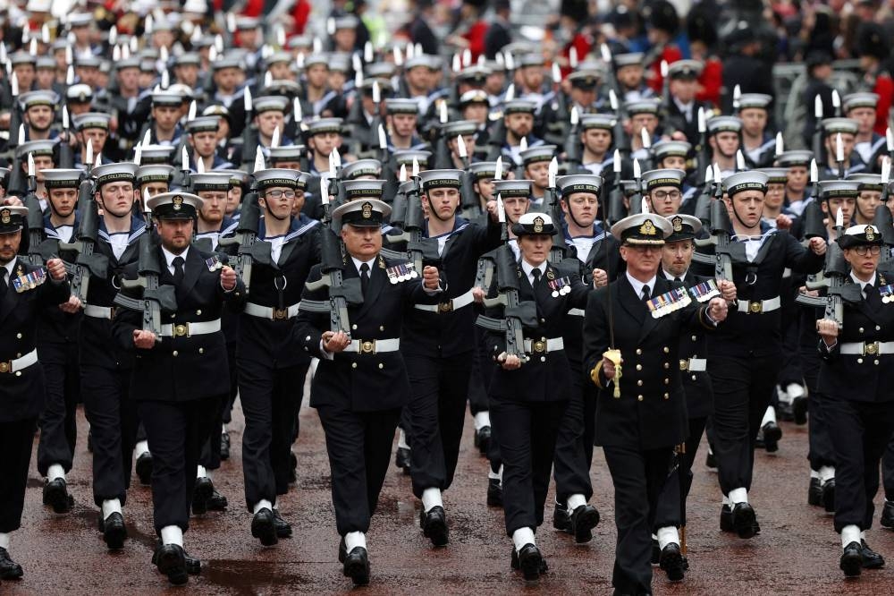 Troops march along the Mall in central London on May 6, 2023, following the coronations of Britain's King Charles III and Britain's Queen Camilla. REUTERS