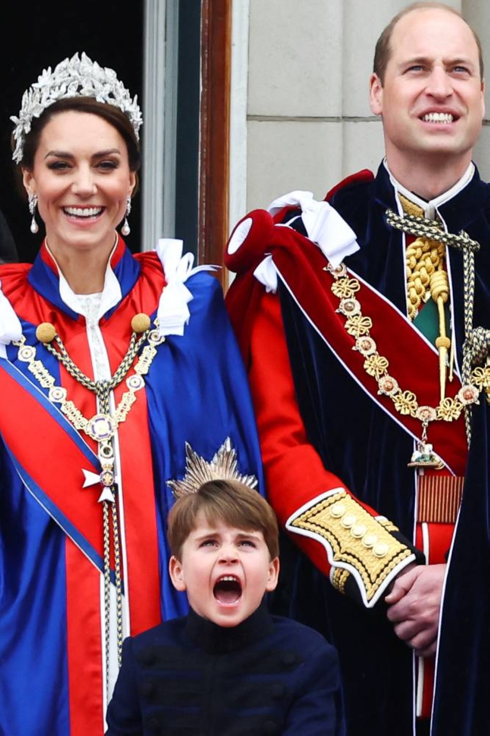 Britain's Prince William, Catherine, Princess of Wales, and Prince Louis stand on the Buckingham Palace balcony . REUTERS
