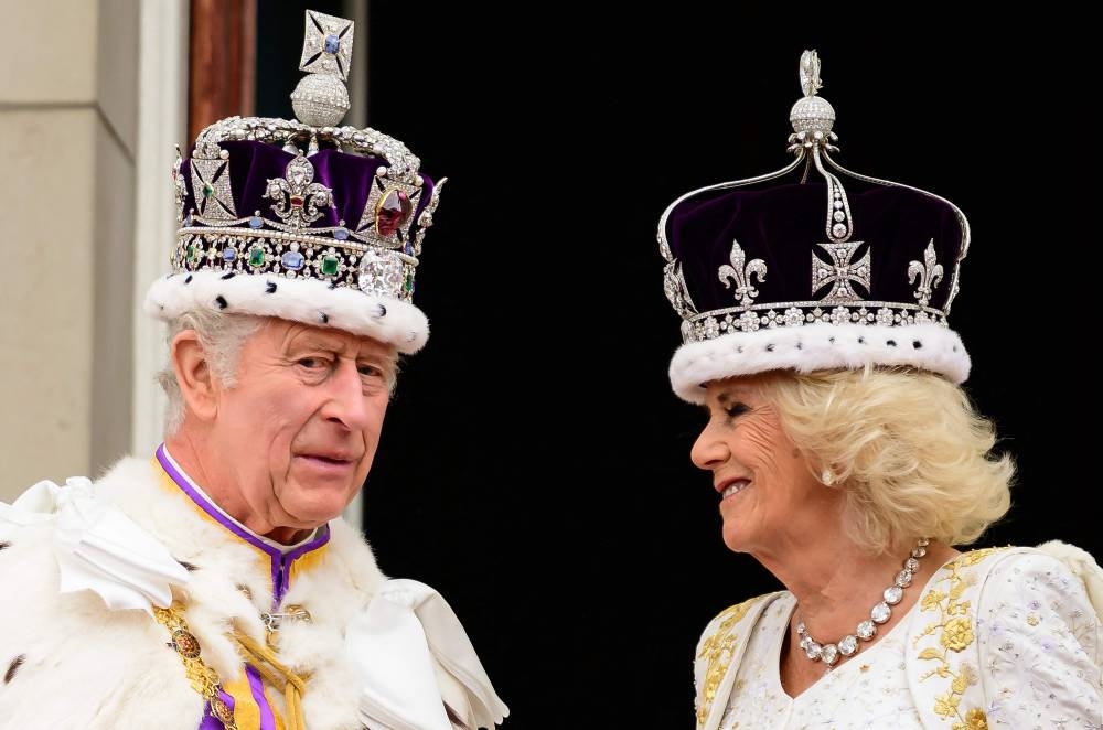 Britain's King Charles III and Queen Camilla stand on the Buckingham Palace balcony, in London, following their coronations. AFP