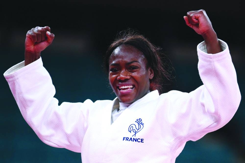 
France’s Clarisse Agbegnenou celebrates winning the judo women’s -63kg gold medal bout against Slovenia’s Tina Trstenjak during the Tokyo 2020 Olympic Games on July 27, 2021. (AFP) 