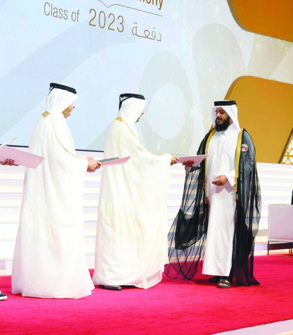 A graduate being honoured by the QU President.
