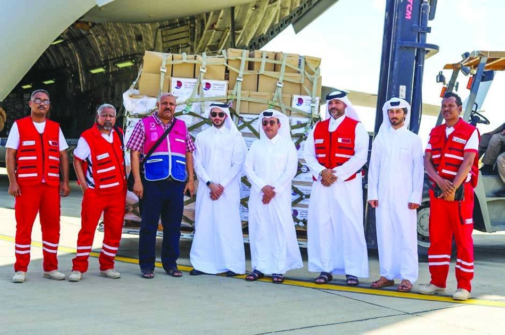 QRCS and other officials with shipment.