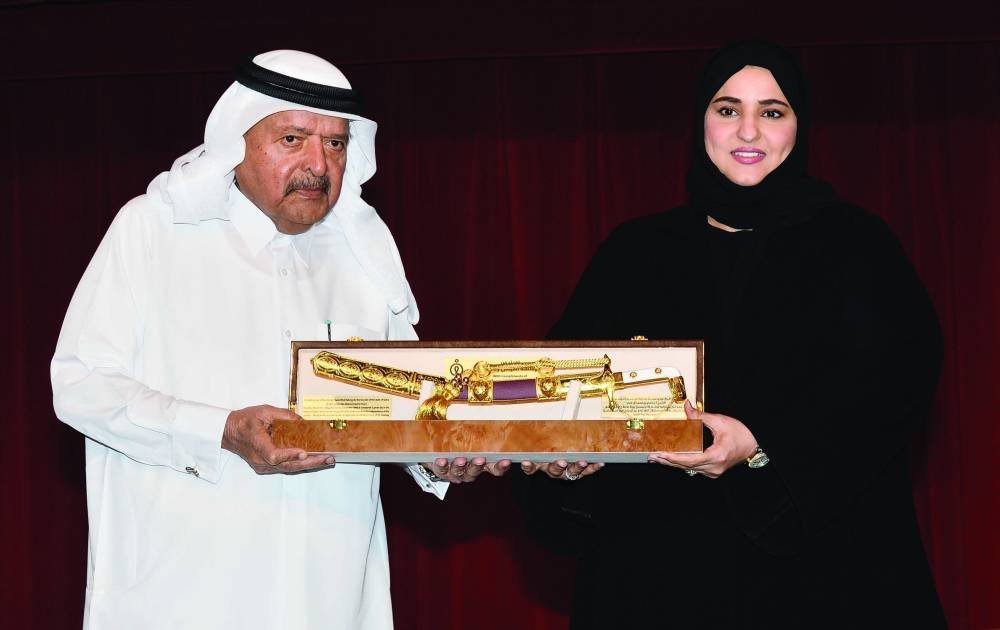 HE Sheikh Faisal bin Qassim al-Thani honouring Maha Zayed al-Rawili at the ceremony. PICTURE: Shaji Kayamkulam.
