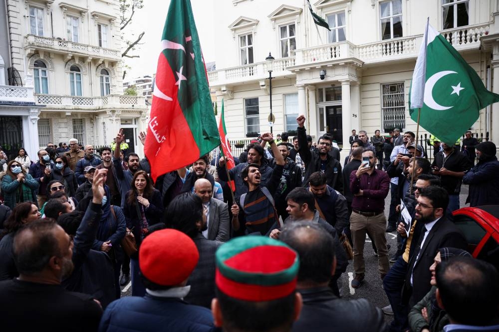 Supporters of Pakistan's former Prime Minister Imran Khan protest against his arrest in Pakistan, outside of the High Commission for Pakistan in London, Britain. REUTERS/Henry Nicholls