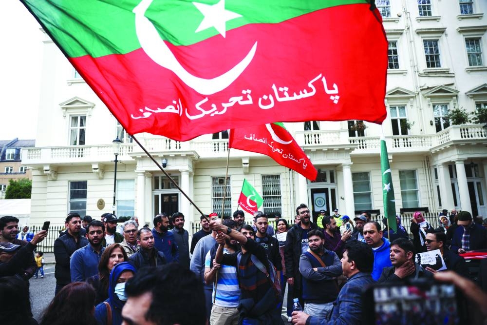 Supporters of Imran Khan protest against his arrest outside the Pakistan High Commission in London. (Reuters)