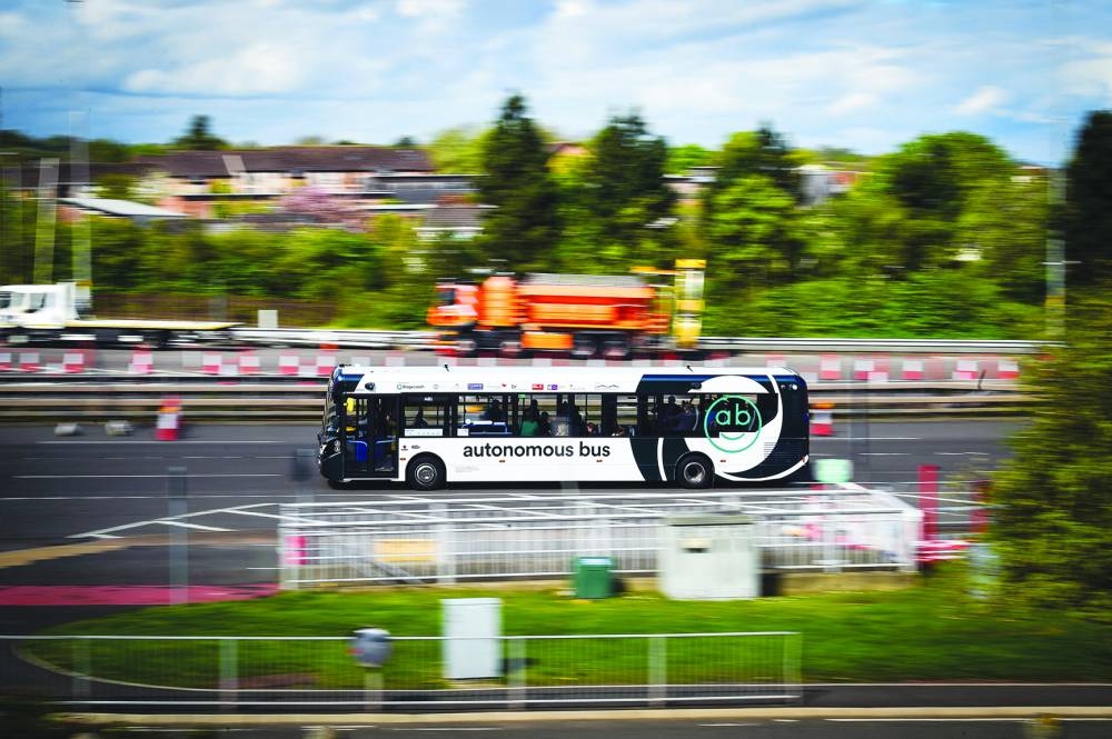 An autonomous bus travelling between Edinburgh and Fife, during a press preview for the CAVForth autonomous bus service, AB1, in Queensferry, Scotland.