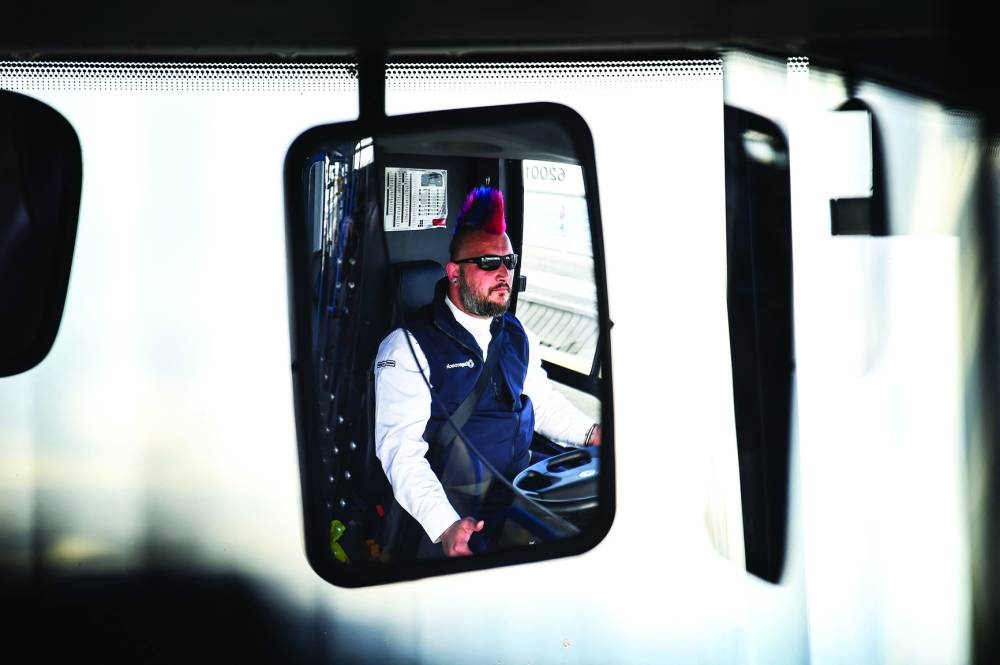 Driver Stuart Doidge monitors an autonomous bus as it drives across the Forth Road Bridge.