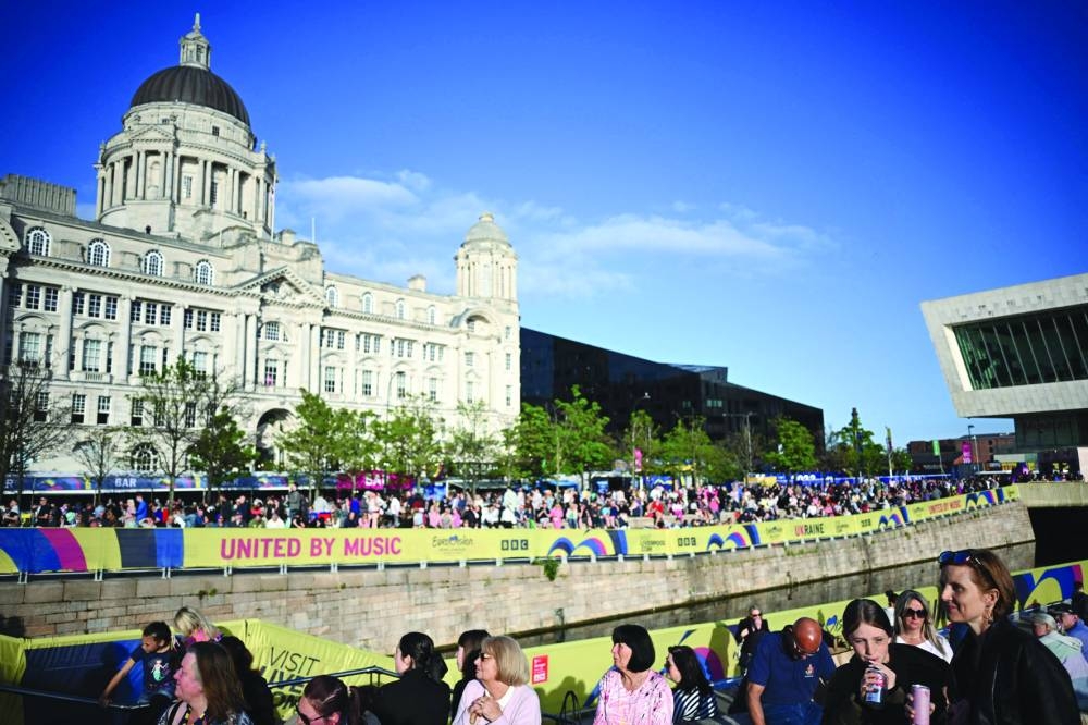 People gather in the Eurovision village at Pier Head on the eve of the final of the Eurovision Song contest 2023 at the M&S Bank Arena in Liverpool.