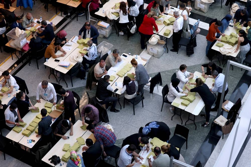 Election officials count votes from abroad on the day of Turkey's presidential and parliamentary elections, in Ankara. REUTERS/Yves Herman