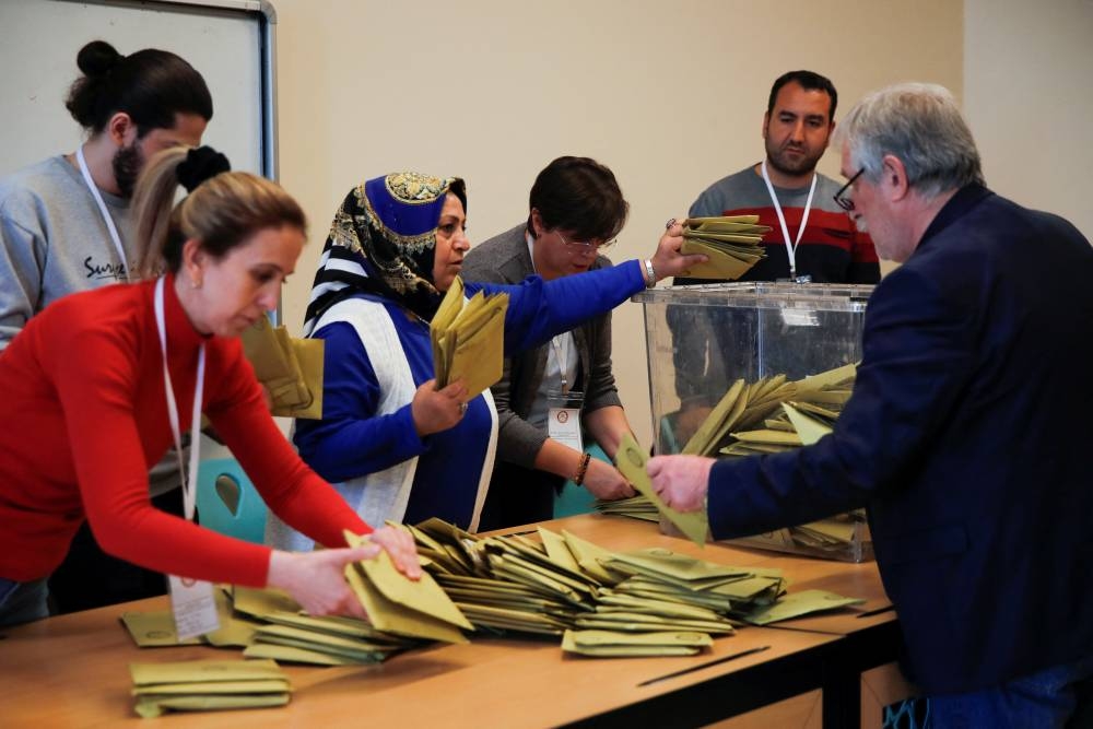 Officials work on the day of the presidential and parliamentary elections in Istanbul. REUTERS/Dilara Senkaya