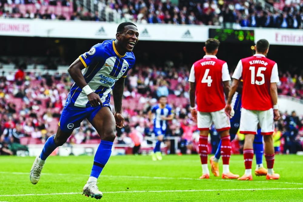 Brighton’s Pervis Estupinan celebrates after scoring his team’s third goal against Arsenal in London 
yesterday. (AFP)