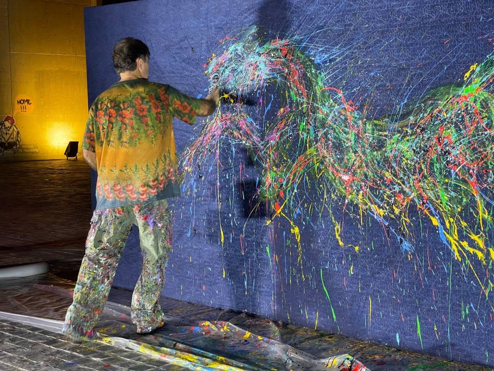 Artist Eduardo Navarro in action yesterday.