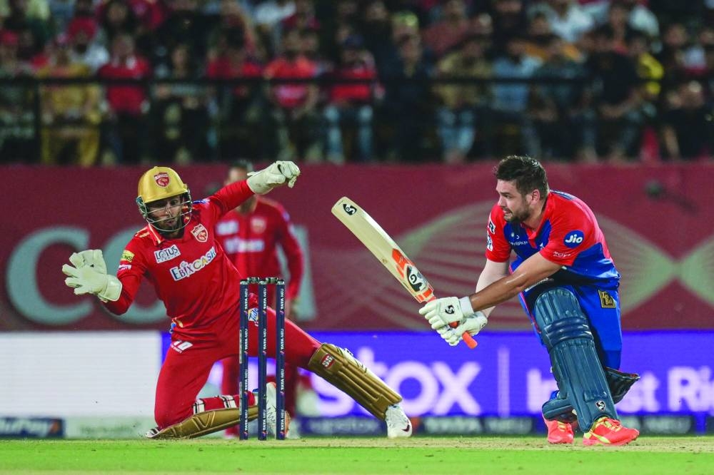 Delhi Capitals' Rilee Rossouw (right) plays a shot during the IPL match against Punjab Kings at the Himachal Pradesh Cricket Association Stadium in Dharamsala on Wednesday. (AFP)