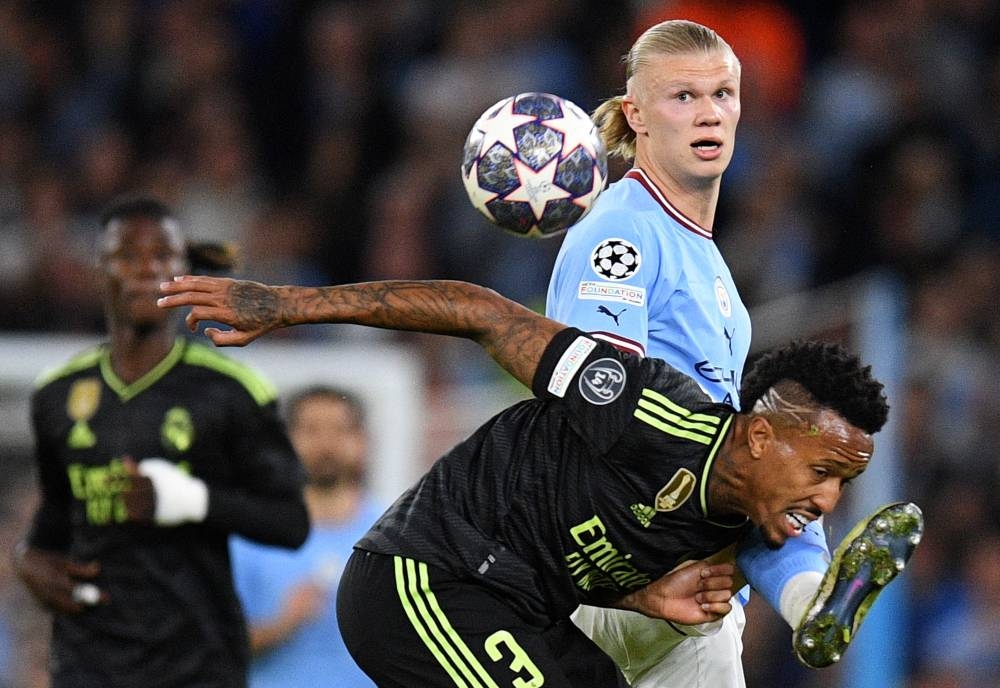 Real Madrid's Brazilian defender Eder Militao (right) vies with Manchester City's Norwegian striker Erling Haaland during the UEFA Champions League second leg semi-final football match between Manchester City and Real Madrid at the Etihad Stadium in Manchester, north west England, on Wednesday, (AFP)