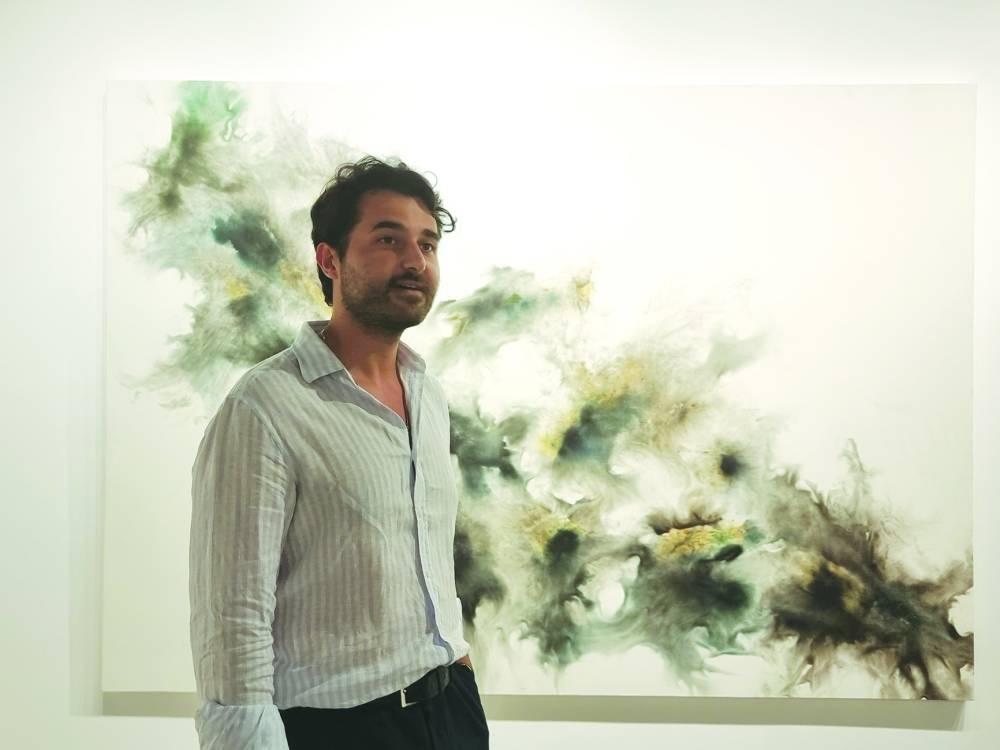 Garo Bardakjaian showcases Jean Boghossian's work, titled ‘Ready, Aim, Fire’, at the exhibition. PICTURES: Joey Aguilar