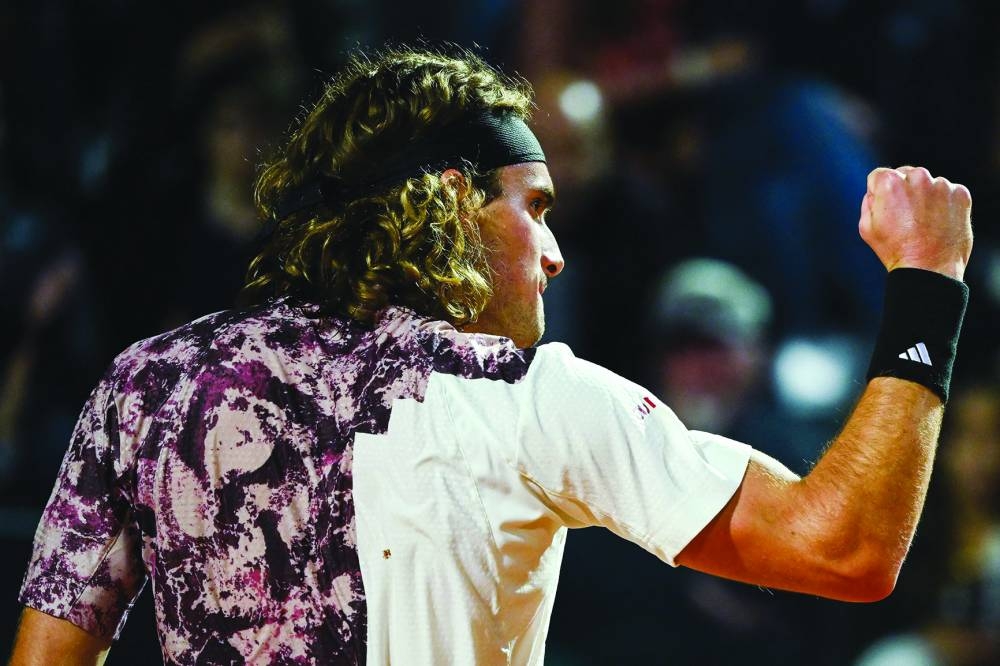 
Greece’s Stefanos Tsitsipas celebrates winning a point against Croatia’s Borna Coric in their quarter-final at the Rome Open. (AFP) 