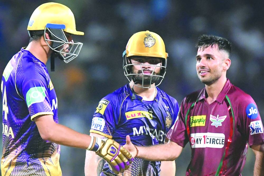Kolkata Knight Riders’ Rinku Singh (centre) looks on as Lucknow Super Giants’ Ravi Bishnoi (right) celebrates after winning the IPL match in Kolkata on Saturday. (AFP)