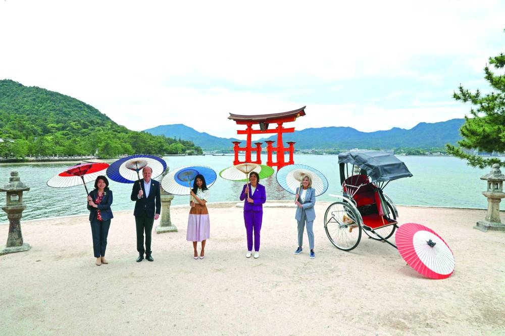 
Japan’s First Lady Yuko Kishida (left), Heiko von der Leyen (husband of European Commission President Ursula von der Leyen), Akshata Murty (wife of British Prime Minister Rishi Sunak), Britta Ernst (wife of German Chancellor Olaf Scholz) and US First Lady Jill Biden (right) pose for a photo during a visit to Itsukushima Shrine on Miyajima island, near Hiroshima, on the sidelines of the G7 Summit Leaders’ Meeting. 