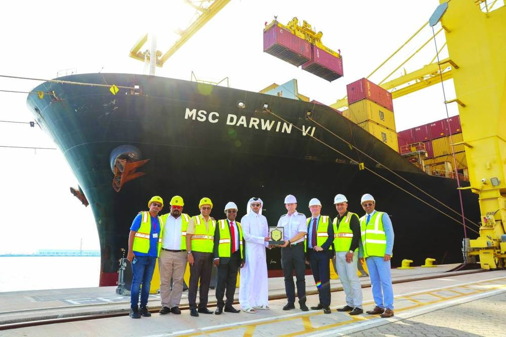 Pictured are officials marking the commencement of a new weekly shipping line.