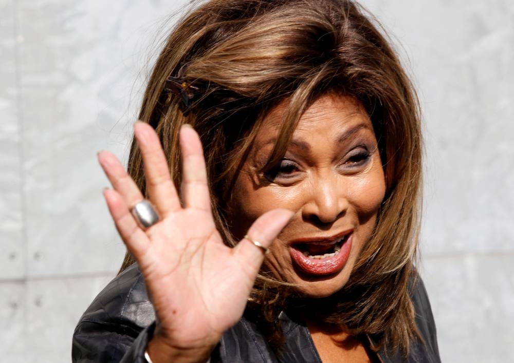 Tina Turner waves during a photo call before the Emporio Armani Autumn/Winter 2011 women's collection show at Milan Fashion Week, Italy February 26, 2011.  REUTERS/Stefano Rellandini/File Photo